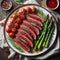 A perfectly seared steak takes center stage on a plate decorated with a variety of bright vegetables.