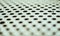 Perforated aluminium sheet of metal texture. Old surface with depth of field, abstract industrial mesh vintage background