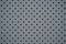Perforated grey iron sheet texture. Abstract industrial mesh. Iron Grill With Mesh Backing