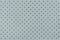 Perforated light blue leather texture background, closeup. backdrop from wrinkle skin