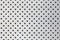 Perforated silver metal surface, industrial background