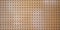 Perforated wooden plank wall for geometric wooden background