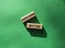 Perform better symbol. Wooden blocks with words Perform better. Beautiful green background. Business and Perform better concept.