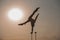 Performance of an aerialist outdoors during sunset