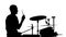 Performer plays professional music on drums. White background. Silhouettes. Side view