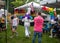 Performer with rainbow feathers hurries back to stage at Pride Fest