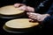 Performers playing bongo drums. Close up of musician hand playing bongos drums. Drum. Hands of a musician playing on