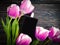 Perfume bottle flower tulip on a wooden background