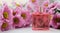 A perfume bottle surrounded by pink chrysanthemum flowers. Eau de toilette, eau de parfum, beauty concept