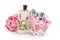 Perfume bottles with flowers on light background. Perfumery, cosmetics, fragrance collection