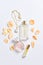 Perfume bottles with flowers petals on white background. Perfumery, cosmetics, jewelry and fragrance collection