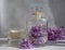 Perfume for home, lilac flower,  vintage candle   composition decor  fragrance relaxation  refreshing on a light background