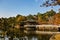 Pergola and bridge reflection on a lake in Kyoto