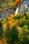 Periodic incredible waterfall in the autumn mountains