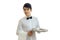 Perky young waiter looks to the side and holding a blank tray for eating