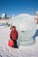 PERM, RUSSIA, Feb, 06.2016: Boy stands in a round of ice sculpture, urban esplanade