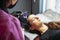 Permanent makeup procedure eyebrow make up brow tattoo close up selective focus