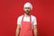 Perplexed confused young bearded male chef cook or baker man in striped apron white t-shirt toque chefs hat posing