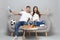 Perplexed couple woman man football fans in white t-shirt cheer up support favorite team with pipe, spreading hands