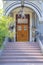 Perron stairs at the front of the porch with huge wooden double door at San Francisco, California