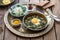 Persian breakfast with eggs, bean and dill in copper pan