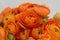 Persian buttercup. Bunch pale orange ranunculus flowers light background