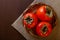 Persimmon in a basket on burlap on a wooden table