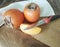 Persimmon freshness on a wooden knife table exotic