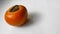 Persimmon fruits , gray , white background. Copy space