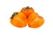 Persimmon orange fruit with green leaves or sharon fruit one whole and one cut in two halves on white background isolated closeup