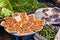 Persimmons and purple fig fruits are on plastic boxes. Fruit and vegetable marketplace is in the Alanya, Turkey