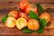 Persimmons with vintage copper vase on old wood. Oriental still life