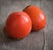 persimmons on wooden table