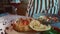 person adding red paprika on bread bowl with pilaf on wooden board