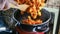 Person adds fried pumpkin in cooking pan