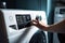 A person adjusting the knob on a washing machine. AI generative image.