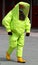 Person with anti radiation suit yellow and yellow rubber boots t