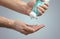 Person applying hand sanitiser gel to kill bacteria and disease - Close up of hands washing and cleansing with hygienic