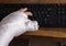 Person with arm cast typing on a keyboard