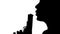 Person blowing on the barrel of a gun. Silhouette. White