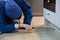 Person in a blue costume and an anti-gas mask doing a sanitary inspection in the room