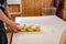 Person braiding a loaf of swiss zopf bread with their hands