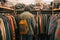 person browsing racks of assorted vintage clothing