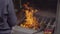 A person burns joss papers or offerings papers in a buddhist temple