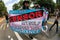 Person Carries Banner Walking At LGBTQ Parade In Atlanta