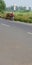 A person carrying fuel wood on his bicycles on the road side in India