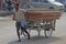 Person Carrying Wooden Planks