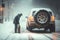 person, changing tires on car in the middle of winter storm