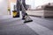 Person Cleaning Carpet With Vacuum Cleaner