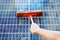 Person Cleaning Solar Panel